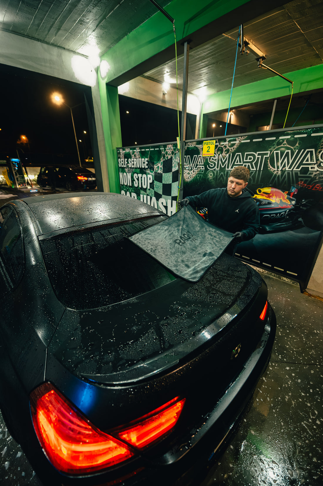 RAG PRO towel drying a car roof in a wash bay